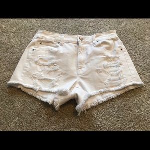 white ripped shorts